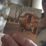 George Smith Holding Image of the newly restored Reading wagon in Bently